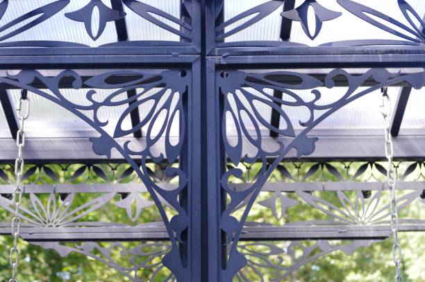 Decorative forging of metal. Design of structural elements. Pergola en fer forgé